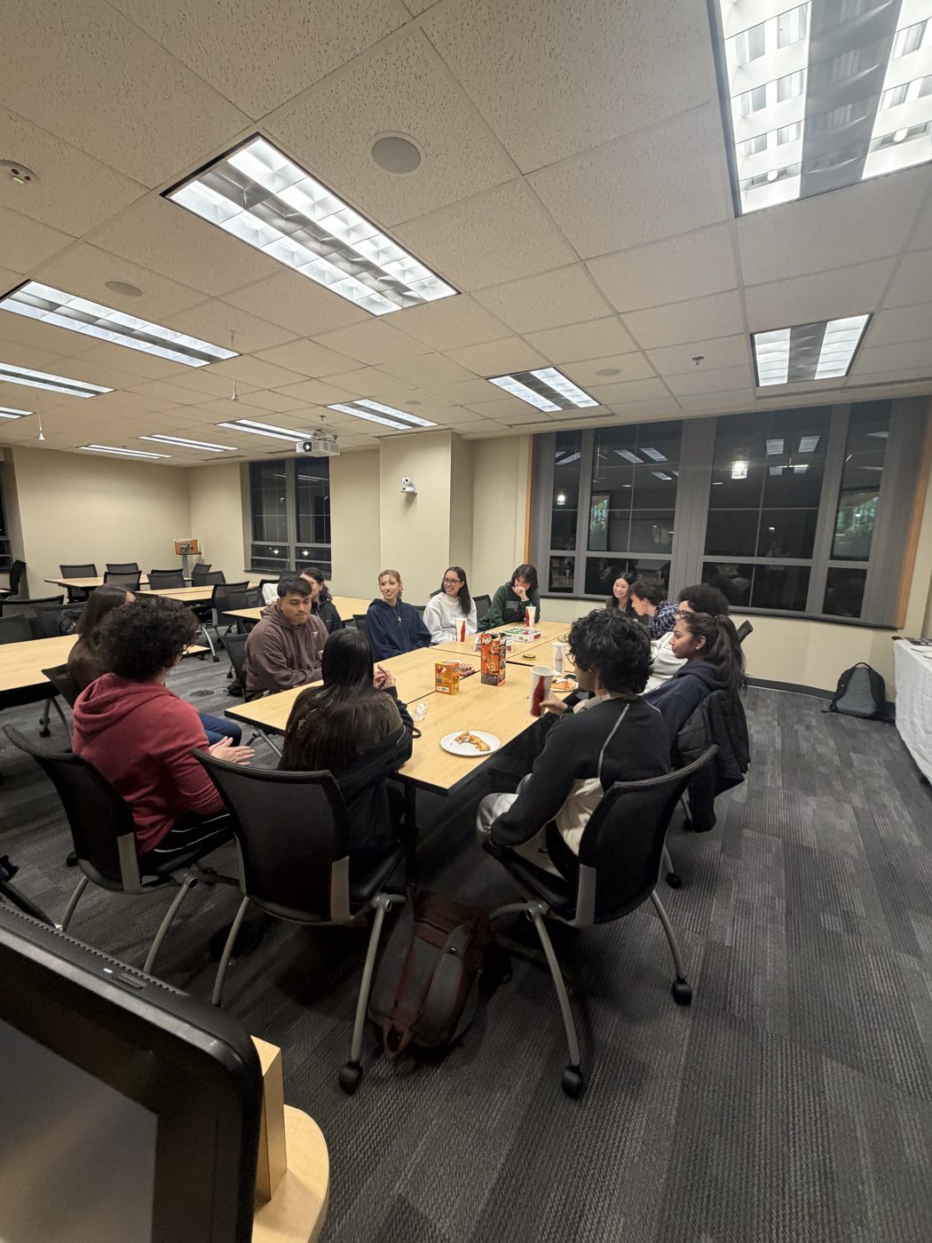 Members around the table at a general body meeting